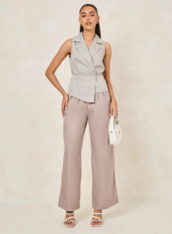 شلوار پارچه‌ای دم‌پا گشاد و کژوال با جزئیات پلیسه